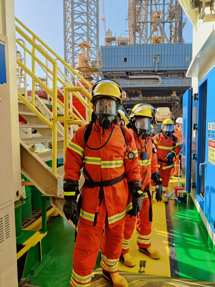 pexels-photo-7932921 Firefighters wearing gas masks and gear at Ras Laffan industrial facility, Qatar.